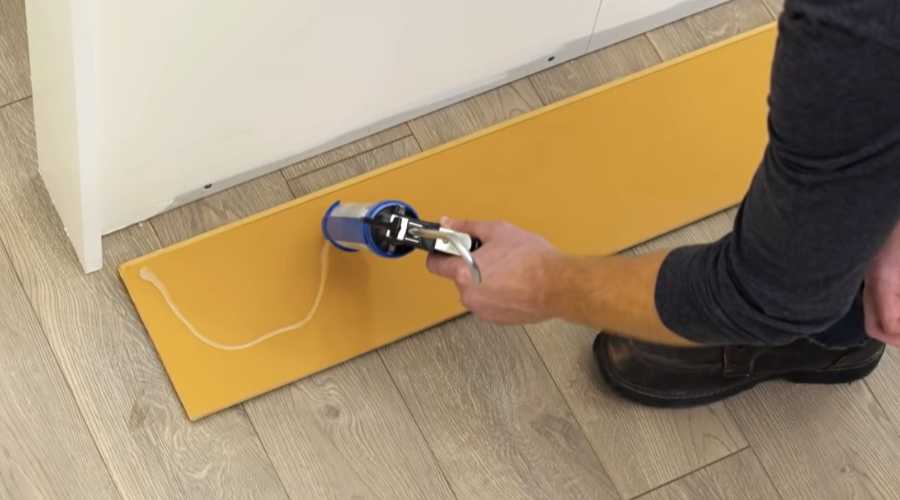 Using adhesive for installing laminate flooring