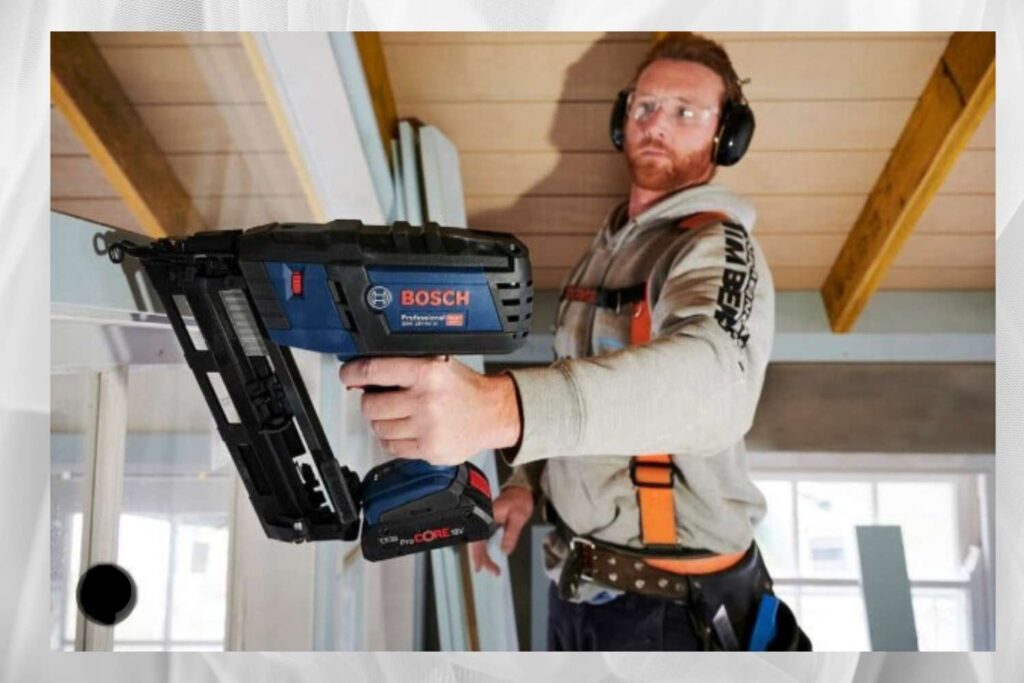A carpenter working with a Cordless Nailer